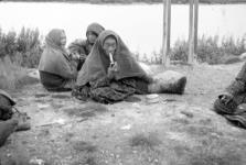 Three Inuit women, one smoking a pipe 1944