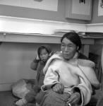 Inuit artist Lucy and her child in the art centre [graphic material] Aug. 1961