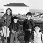 Inuit children [(from left to right) Unknown, Nanauq, George Tanuyak, Helen Niviaqjuk] 1948.
