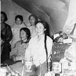 Group of Inuit inside a tupiq (skin tent) 1948
