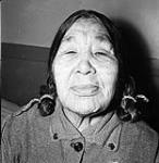 Elderly Inuk woman with face tattoos presently living in the Industrial Home at Chesterfield Inlet 1950