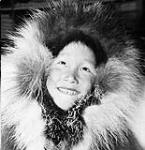 Young Inuk boy, from the Read Island area, in a caribou parka 1950