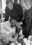 Dr. Norman Bethune performing a blood transfusion during the Spanish Civil War 1936-1938.