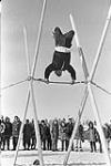 Flying trapeze competition - First Arctic Winter Games. Yellowknife, N.W.T., March 1970 Mar. 1970