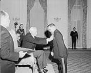 Quartermaster-sergeant (WO 2) Walter Leja receiving the George Medal from General Georges P. Vanier, Governor-general of Canada 1964.