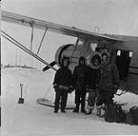 Plane - H.B.Co. clerk, G. Johnson, H. Sparling, (H.B.Co.post manager) and J.V. Jacobson 1953