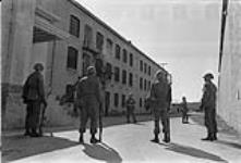 3 RCR stands perimeter guard duty inside the walls of Kingston Penitentiary - Kingston, Ontario - Photographer WO A.E. Scott April 1971.