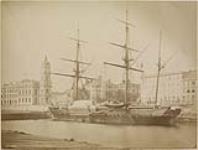 Sailboat at wharf. Custom House in background ca. 1872