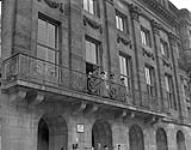 General Crerar with Queen Wilhelmina and party on Palace balcony - Parade in Amsterdam for Queen Wilhelmina's return by Canadian troops and Dutch organizations June 28, 1945.