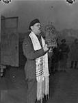 Near Cleve - 1st Canadian Army - Service held by personnel of Jewish faith meeting for the first time in the Canadian theatre of operations on German soil - Captain Samuel Class of Montreal and Vancouver March 18, 1945.