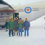 [Inuit in front of Herc AC at Pond Inlet] [1974]