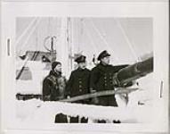 [Ship's crew at work on icy ship deck] n.d.