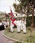 HMCS QUEBEC Parading the White Ensign in Rio - South America cruise 1954
