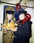 Christmas at Sea - 2 sailors and a turkey [ca. 1942-1945]