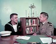 Protestant Chaplain B.A. Peglar interviewing Petty Officer Raymon Laychuck 1957