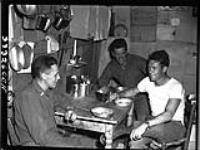 [Three soldiers at mealtime] [1939-1945].