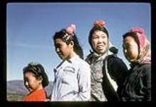 Inuit girls standing outside, Kangiqsualujjuaq (George River), Quebec. [l to r: Minnie Etok, Susie Sarah Eve Etok, Sarah Etok Annanack, Jessie Annanack.] [between July 13-August 9, 1960]