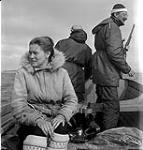 [Barbara Hinds (left), a man, and Mackenzie Porter (right) on a boat, Iqaluit, Nunavut] [between 1956-1960]