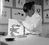 [Artist Lukta Qiatsuk making a print, Kinngait, Nunavut] 1960