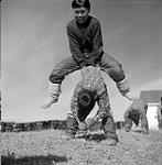 [Boys playing leapfrog] [between 1956-1960]