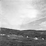 [Landscape view of tents scattered on a hillside] [between 1956-1960]