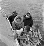 [Alma Houston (middle right), a woman, two girls and a man in a boat] [between 1956-1960]