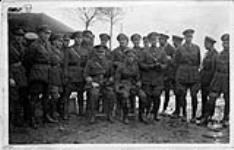 Group Photo-1st contingent of #3 Wing. L to R, Lee, R. Collishaw, G.S. Harrower, K.G. MacDonald, C.E. Burden, St. Edwards, McGregor, Pearkes, Dallison, Donnes, F.C. Armstrong, J.A. Glen LCdr. RNVR, J.E. Sharman, L.E. Smith, Alexander, Newberry. Sitting: Capt. Elder and W/C. R. Bell-Davies 1915-1918.