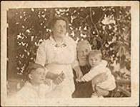 Leila and James Geggie, with Jamie and Eric Chaplin 1881?.