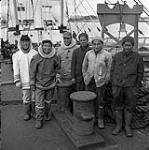 [Men standing on a boat, Iqaluit, Nunavut] [between 1956-1960]
