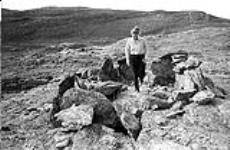 [Barbara Hinds walking into a circle of rocks] [between 1956-1960]