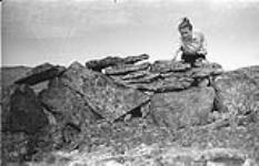 [Barbara Hinds stacking rocks] [between 1956-1960]