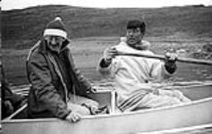 [Mackenzie Porter (left) and a man in a canoe, Iqaluit, Nunavut] 1960
