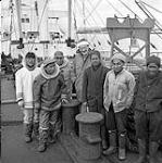 [Group of men standing on a boat, Iqaluit, Nunavut] 1960