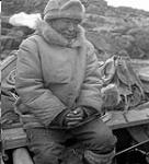 [Spyglassie sitting on a boat, Iqaluit, Nunavut] 1960