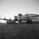 [Plane outside of an aircraft hangar, Iqaluit, Nunavut] 1960