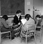 [Woman teaching students to read, Iqaluit, Nunavut] 1960