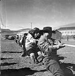 [People playing tug o' war, Niaqunngut, Iqaluit, Nunavut] 1960