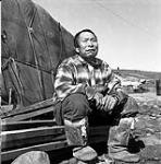 [Inuksiak sitting outside, Iqaluit, Nunavut] 1960