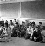 [Children sitting on the floor in a classroom, Iqaluit, Nunavut] 1960