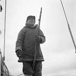 [Mike holding a harpoon, Iqaluit, Nunavut] 1960