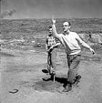 [Ken Green (right) and a man playing horseshoes, Iqaluit, Nunavut] 1960