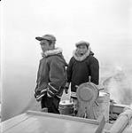 [Isa (left) and Spyglassie (right) on a boat, Iqaluit, Nunavut] 1960