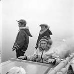 [Mike (left), Spyglassie (middle) and Bob Green (right) in a boat, Iqaluit, Nunavut] 1960