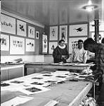 [People working in a print shop, Kinngait, Nunavut] 1960