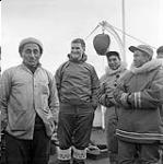 [Group of men on a cargo ship, Kinngait, Nunavut] 1960