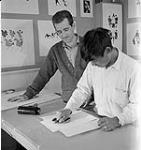 [Terry Ryan (left) observing Lukta Qiatsuk (right) making a print, Kinngait, Nunavut] 1960