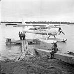 [Canadian Pacific Air Lines floatplane arriving, Aklavik, Northwest Territories] 1956