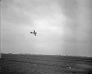 Flamethrower Typhoons drop flame canisters on target near the River Maas, north of 's-Hertogenbosch April 1,1945.