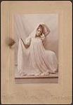 Portrait of Madge Macbeth striking a Loie Fuller inspired dance pose (pose 2) 1895.