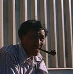 Inuit man smoking pipe [Marc Alikaswa] 1979.